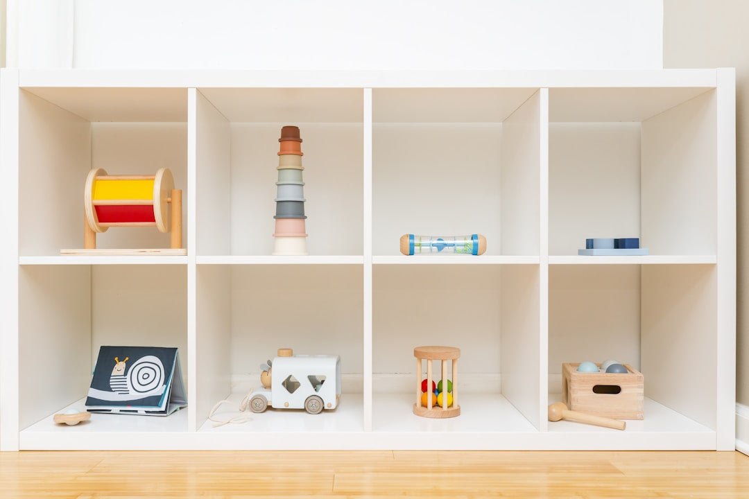 A Montessori-inspired shelf filled with wooden toys for babies and toddlers.